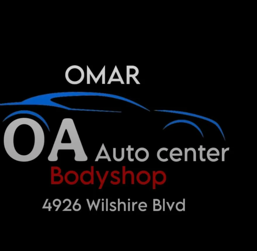 OA Auto Center shop truck with the business name painted on the tailgate